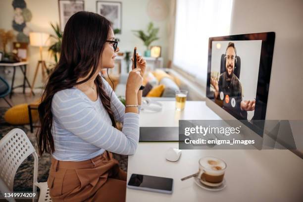 business meeting on video call during - two people video conferencing stock pictures, royalty-free photos & images