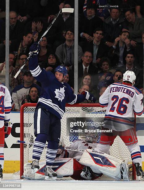 Tim Connolly of the Toronto Maple Leafs scores a second period goal against Henrik Lundqvist of the New York Rangers at Madison Square Garden on...