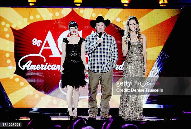 Recording artists Susie Brown and Danelle Leverett of The JaneDear Girls and comedian/singer Rodney Carrington speak onstage during the 2011 American...