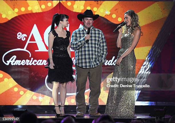 Recording artists Susie Brown and Danelle Leverett of The JaneDear Girls and comedian/singer Rodney Carrington speak onstage during the 2011 American...