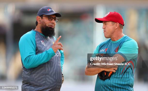 Saqlain Mushtaq, Coach of Pakistan interacts with Andy FLower, Coach of Afghanistan during the ICC Men's T20 World Cup match between Pakistan and...