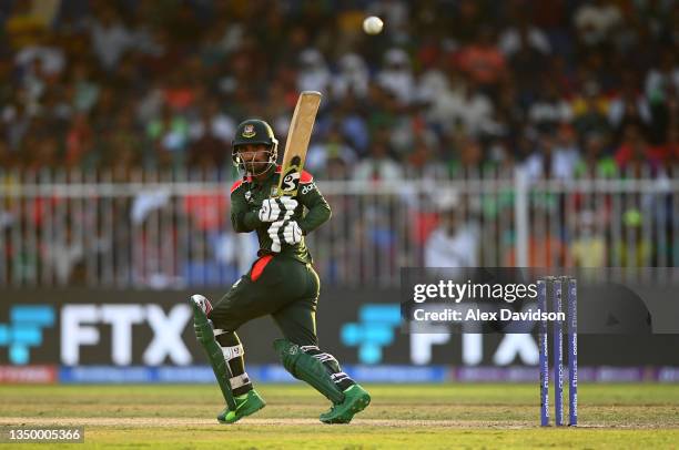 Liton Das of Bangladesh plays a shot during the ICC Men's T20 World Cup match between West Indies and Bangladesh at Sharjah Cricket Stadium on...