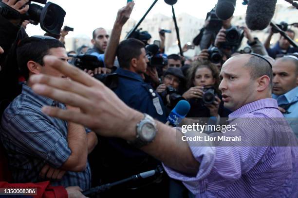 Naftali Bennett , head of the Israeli hardline national religious party, Jewish Home,speaks to the press during a visits the Western Wall, Judaism...