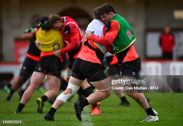 Tom Curry and Sam Simmonds of England wrestle during a training session at Jersey Reds Rugby Club on October 29, 2021 in Saint Peter, Jersey.