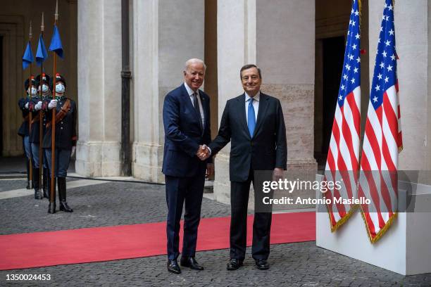 President Joe Biden and Italian Prime Minister Mario Draghi shake hands before their meeting at Palazzo Chigi, on October 29, 2021 in Rome, Italy. US...