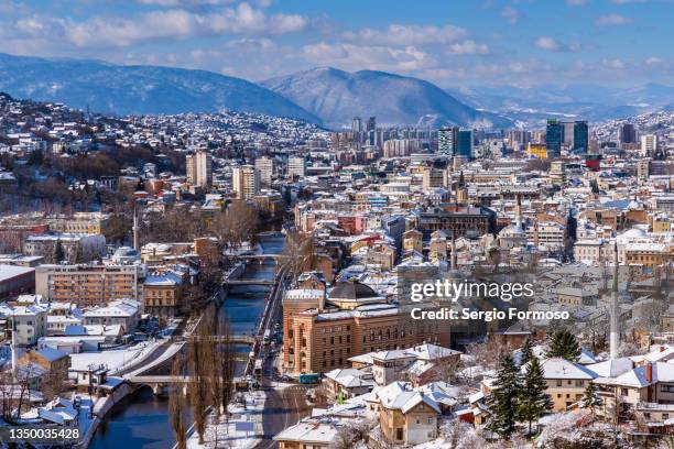 sarajevo cityscape covered by snow - sarajevo stock-fotos und bilder