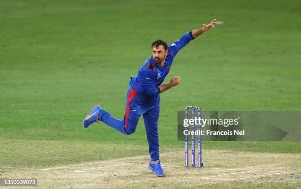 Mohammad Nabi of Afghanistan in bowling action during the ICC Men's T20 World Cup match between Pakistan and Afghanistan at Dubai International...
