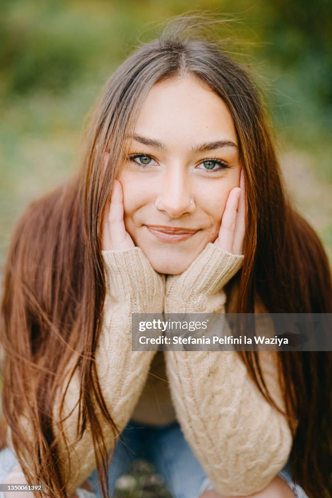 Beautiful Teenager Girl Smiling at The Camera While in Nature
