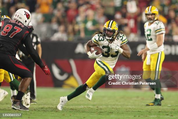 Running back Aaron Jones of the Green Bay Packers rushes the football during the NFL game at State Farm Stadium on October 28, 2021 in Glendale,...