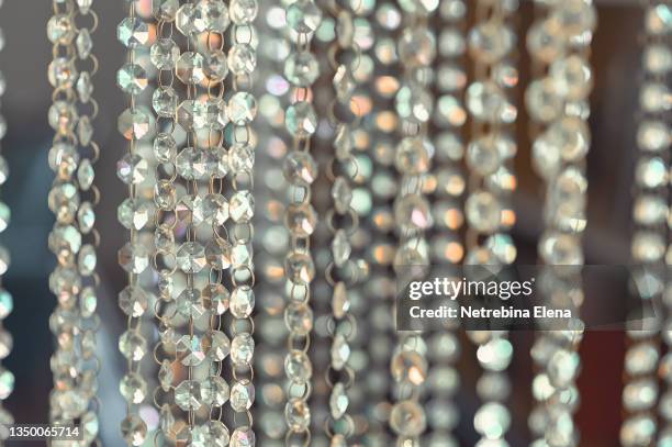 a curtain made of stones similar to diamonds. background for your presentation. decor for business cards - elena collection fotografías e imágenes de stock