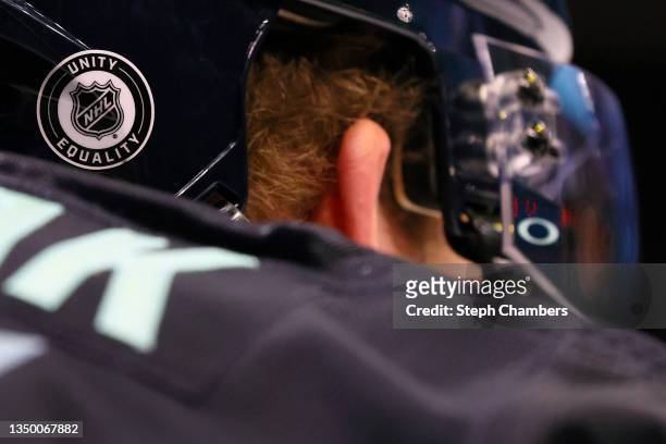 Unity and equality NHL sticker is seen on the helmet of Jamie Oleksiak of the Seattle Kraken before the game Minnesota Wild on October 28, 2021 at...