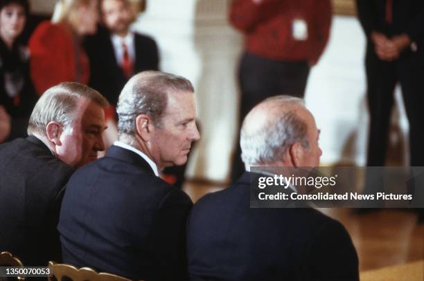 View of, from left, US Attorney General Edwin Meese, Secretary of the Treasury James A Baker III, and Secretary of State George P Shultz in the White...