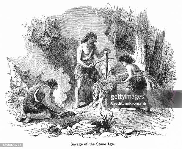 old engraved illustration of prehistoric man (savage) of the stone age - cave fire 個照片及圖片檔