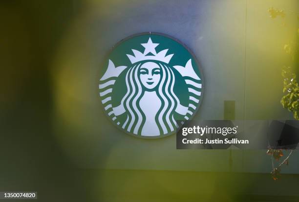 The Starbucks logo is display on the exterior of a Starbucks store on October 29, 2021 in San Francisco, California. Starbucks shares fell 7 percent...