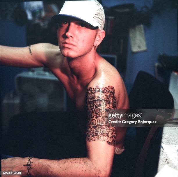 Rapper Eminem at Bob & Charlie Roberts Spotlight Tattoo shop on May 8th, 1999 in Los Angeles, California.
