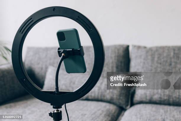ring light with mobile phone at home - youtuber stock pictures, royalty-free photos & images