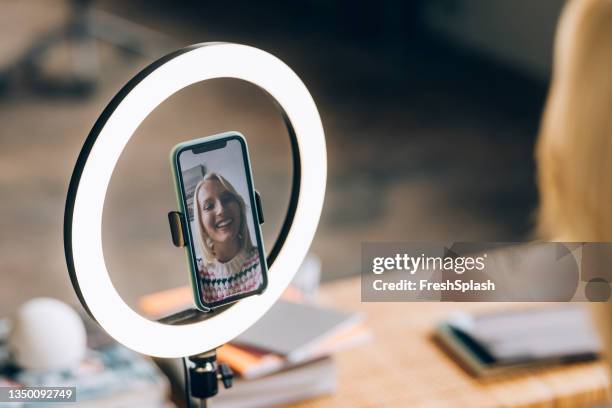 young woman vlogging at home - anel de luz imagens e fotografias de stock