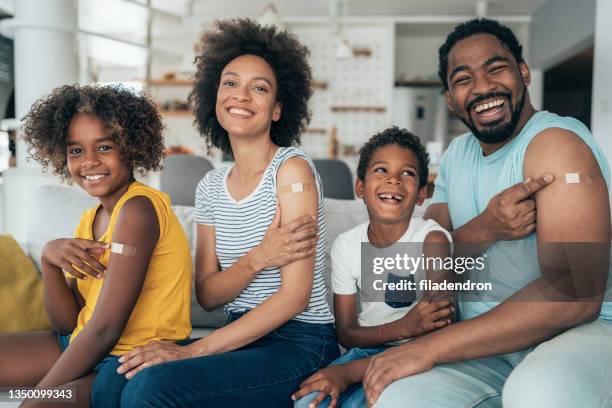 portrait of a vaccinated family - name patch stock pictures, royalty-free photos & images