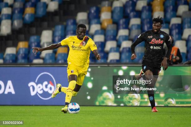 Musa Barrow of Bologna FC chased by André-Frank Zambo Anguissa of SSC Napoli during the Serie A match between SSC Napoli and Bologna FC at Stadio...