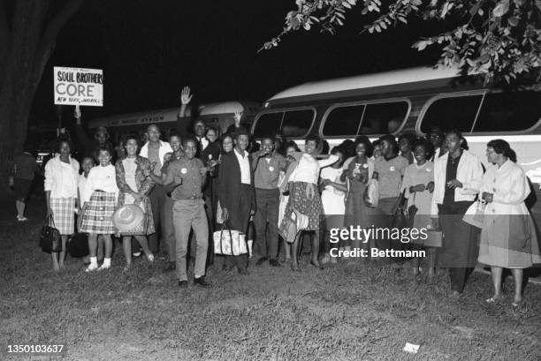 March on Washington participants pose in front of their busses upon their arrival, Washington DC, August 28, 1963. The group is from western...