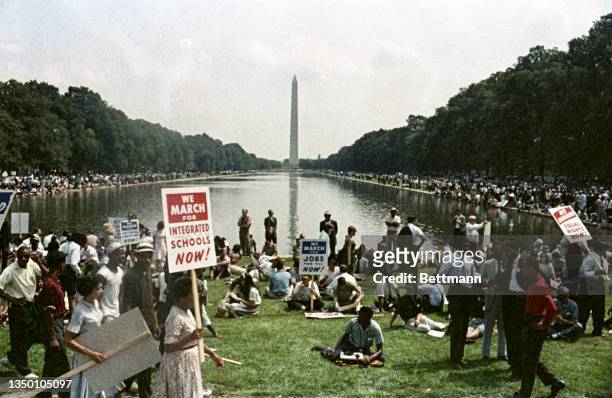 More than two-hundred thousand persons participated in the "March on Washington" demonstration. The throng gathered at the Washington Monument and...