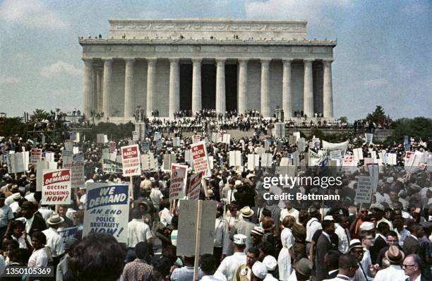 More than two-hundred thousand persons participated in the "March on Washington" demonstration. The throng gathered at the Washington Monument and...