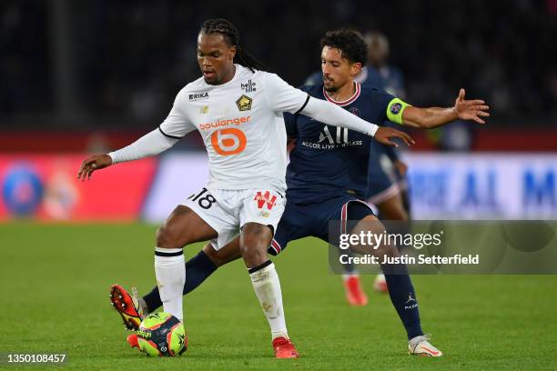 Renato Sanches of Lille holds off Marquinhos of Paris Saint-Germain during the Ligue 1 Uber Eats match between Paris Saint Germain and Lille OSC at...