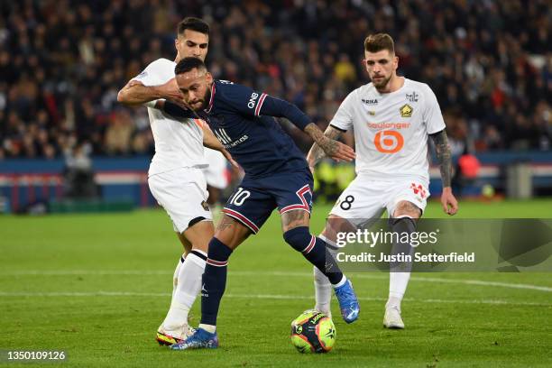 Neymar of Paris Saint-Germain takes on Zeki Celik of Lille and Xeka of Lille during the Ligue 1 Uber Eats match between Paris Saint Germain and Lille...