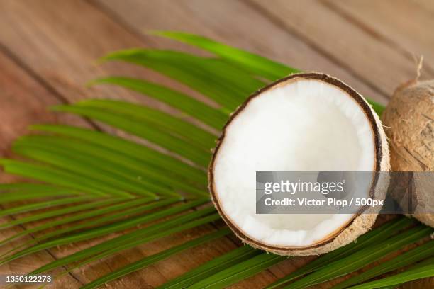 high angle view of coconut on table - fraicheur stock pictures, royalty-free photos & images