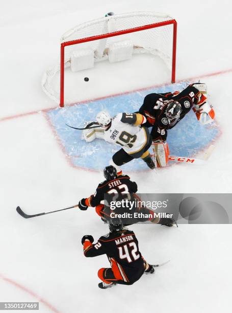 Reilly Smith of the Vegas Golden Knights puts his own rebound past John Gibson of the Anaheim Ducks for a first-period goal as Sam Steel and Josh...