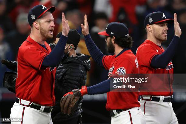 Will Smith of the Atlanta Braves celebrates with Dansby Swanson after closing out the 2-0 win against the Houston Astros in Game Three of the World...