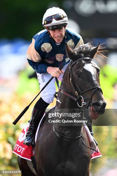 John Allen riding Hitotsu celebrates after winning race 6, the Penfolds Victoria Derby during 2021 AAMI Victoria Derby Day at Flemington Racecourse...