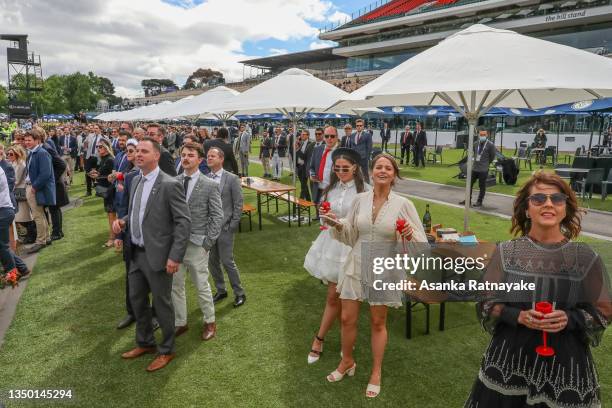 Spectators look on during race 6 at Derby Day at Flemington Racecourse on October 30, 2021 in Melbourne, Australia. Victoria's COVID-19 restrictions...