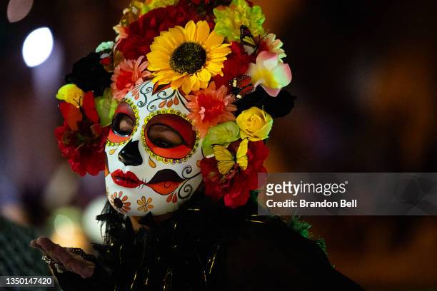 Woman makes a kissing gesture during the Day of the Dead River parade on October 29, 2021 in San Antonio, Texas. People gathered in San Antonio to...
