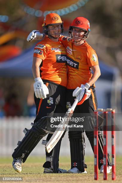 Sophie Devine and Beth Mooney of the Scorchers celebrate winning the Women's Big Bash League match between the Perth Scorchers and the Adelaide...