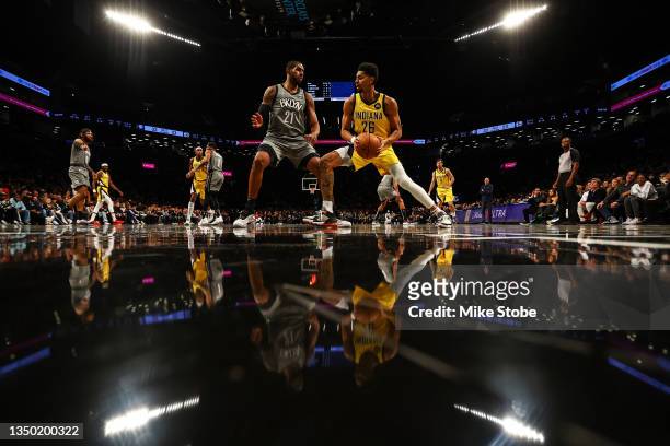 Jeremy Lamb of the Indiana Pacers drives to the net against LaMarcus Aldridge of the Brooklyn Nets at Barclays Center on October 29, 2021 in New York...