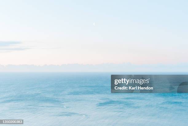 a sunrise view of the sea and sky - stock photo - sunrise over water stock pictures, royalty-free photos & images