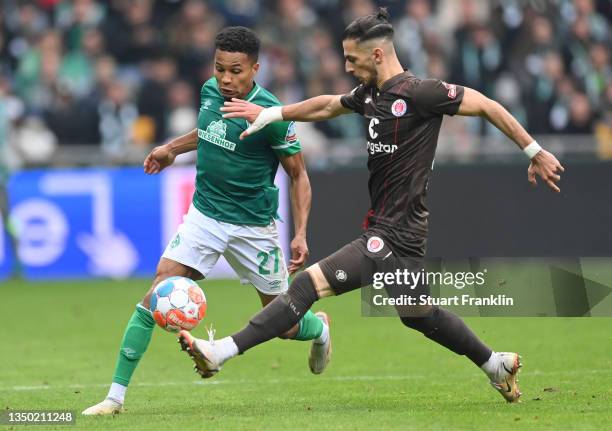 Leart Paqarada of St.Pauli is challenged by Felix Agu of Bremen during the Second Bundesliga match between SV Werder Bremen and FC St. Pauli at...