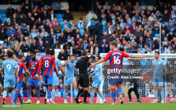 Aymeric Laporte of Manchester City us shown a red card by Referee Andre Marriner during the Premier League match between Manchester City and Crystal...