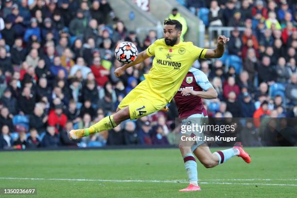 Saman Ghoddos of Brentford scores their team's first goal during the Premier League match between Burnley and Brentford at Turf Moor on October 30,...