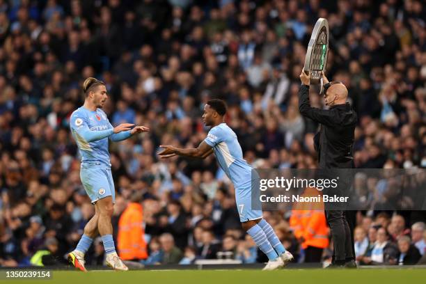 Raheem Sterling is substituted on and replaces Jack Grealish of Manchester City during the Premier League match between Manchester City and Crystal...