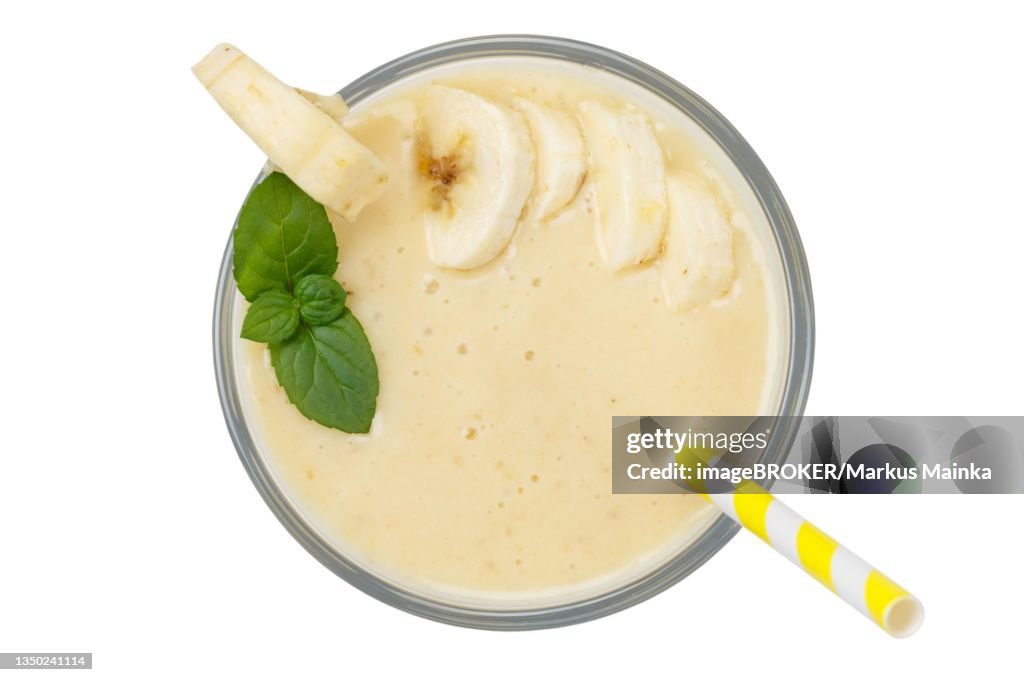 Banana smoothie fruit juice drink juice in glass from above exempted isolated, Germany