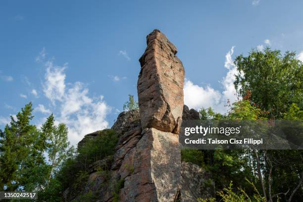 unusual rock formation on top of a mountain - sharp rock formation stock pictures, royalty-free photos & images