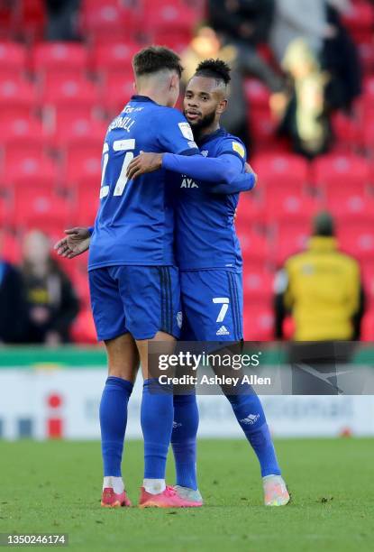 Rubin Colwill and Leandro Bacuna of Cardiff City hug following the Sky Bet Championship match between Stoke City and Cardiff City at Bet365 Stadium...