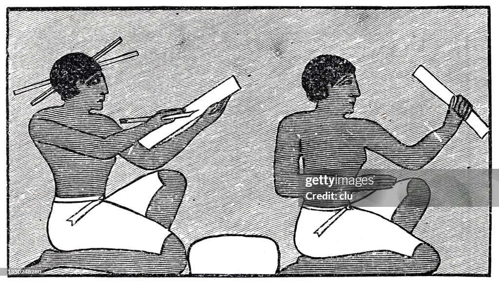 Two ancient egypt writers, sitting one behind the other, working with papyrus paper