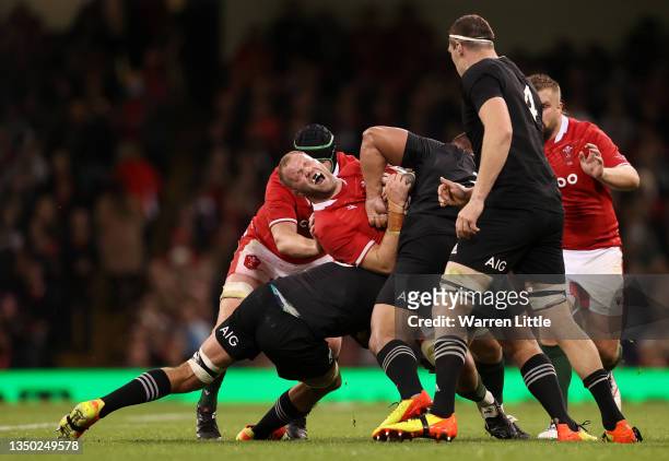 Ross Moriarty of Wales is tackled by Ethan Blackadder and Nepo Laulala of New Zealand during the Autumn International match between Wales and New...
