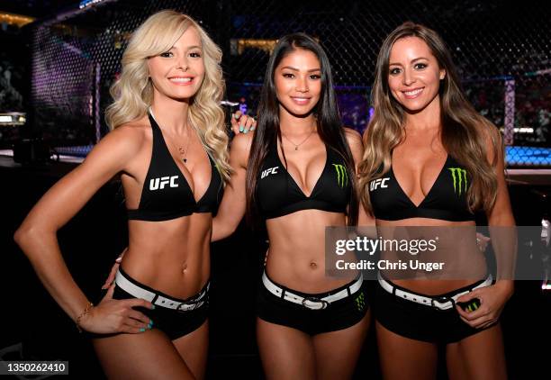 Octagon Girl Jhenny Andrade, Red Dela Cruz, and Carly Baker pose for a photo during the UFC 267 event at Etihad Arena on October 30, 2021 in Yas...