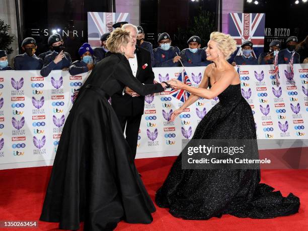 Sharon Stone, Hannah Waddingham and Hannah's father attend the Pride Of Britain Awards 2021 at The Grosvenor House Hotel on October 30, 2021 in...