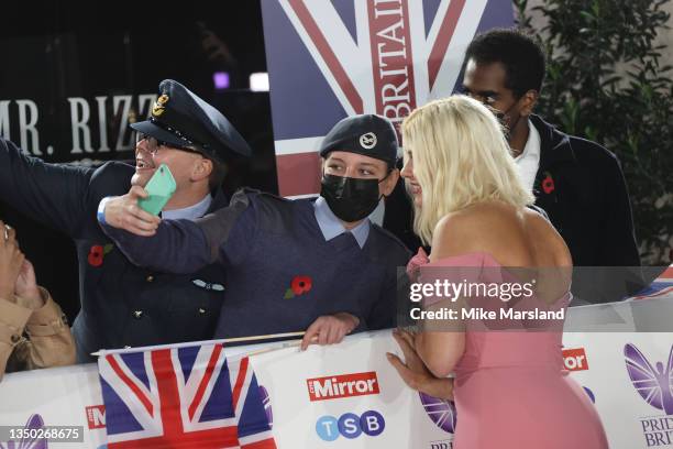 Holly Willoughby takes a selfie with a fan at the Pride Of Britain Awards 2021 at The Grosvenor House Hotel on October 30, 2021 in London, England.