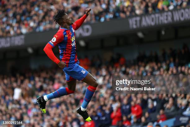 Wilfried Zaha of Crystal Palace celebrates after scoring their team's first goal during the Premier League match between Manchester City and Crystal...
